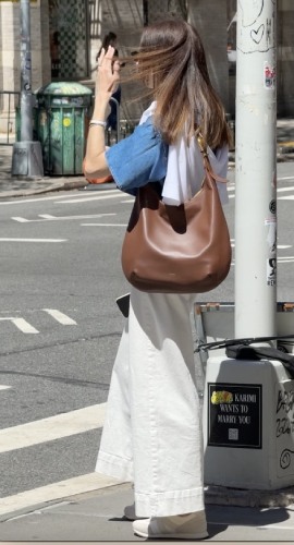 bag with a denim short-sleeve top and crisp white trousers
