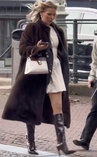 brown teddy trench coat paired with pointed stiletto boots