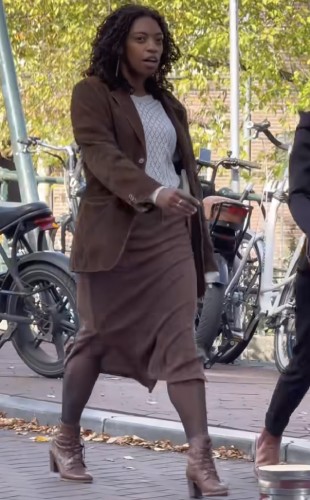 suede brown blazer alongside a matching midi skirt