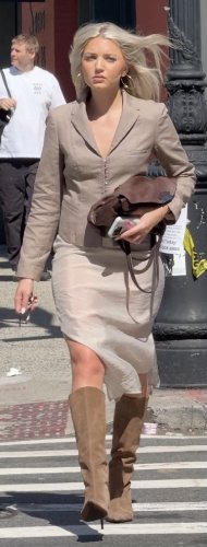 corset-style structured blazer and a sheer tan maxi skirt