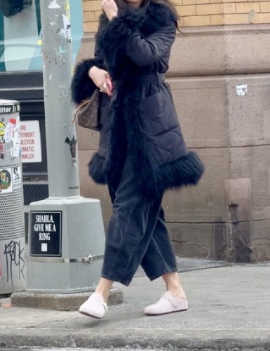 black barrel capris with a fur-detailed trench coat