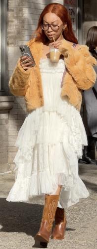 tan cowboy boots and a cozy tan teddy fur coat